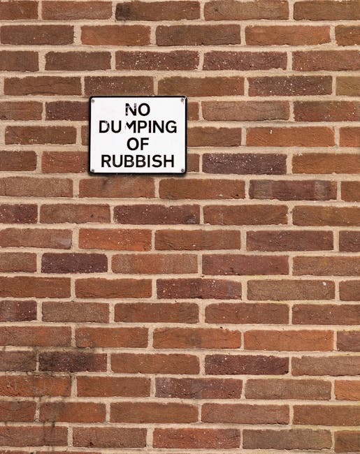 A ground-level view of overflowing rubbish and waste materials scattered across a surface, consisting mainly of crumpled paper, plastic bottles, and beverage containers. The plastic bottles, some with